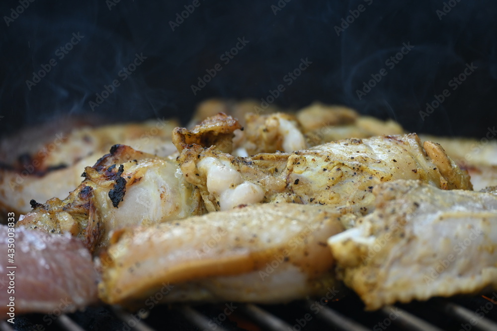 Grilling chicken in a summer barbeque
Grilling chicken in a summer barbeque