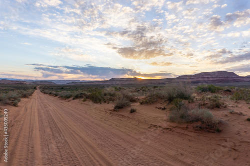 Dirt road at sunset in Utah desert
