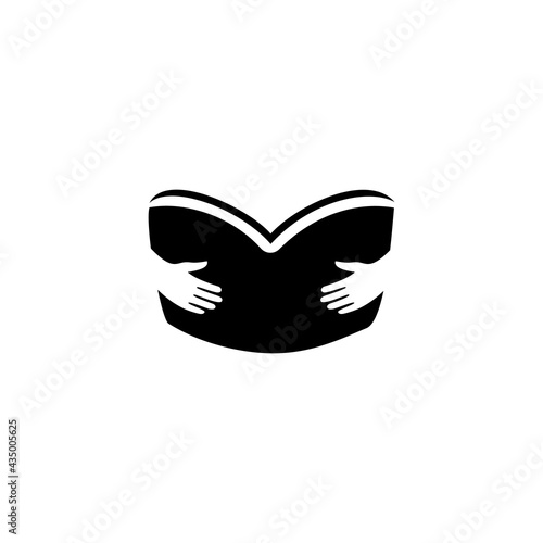 Two Hands Holding a Black Book Isolated on a White Background
