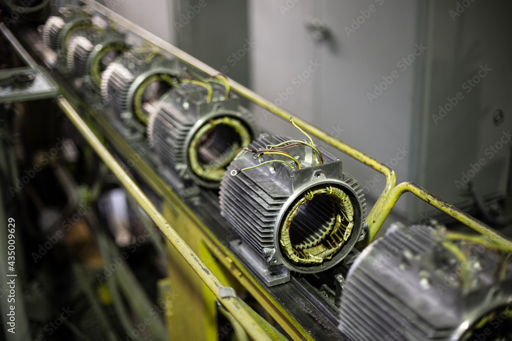 stators of electric motors on assembly line of Semiautomated manual