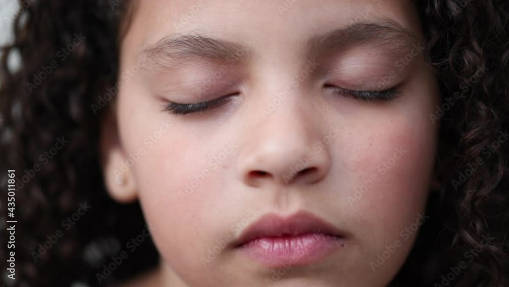 Little girl with eyes closed in contemplation and meditation Little girl with eyes closed in contemplation and meditation