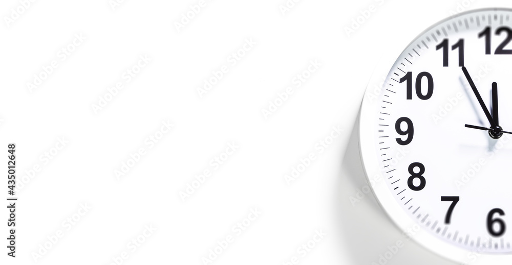 Modern white Wall Clock with black time pointer off center on white background. Shadows on the Clock Face. Concept Clock design with copy space for your own text. Business Clock show the day time Modern white Wall Clock with black time pointer off center on white background. Shadows on the Clock Face. Concept Clock design with copy space for your own text. Business Clock show the day time