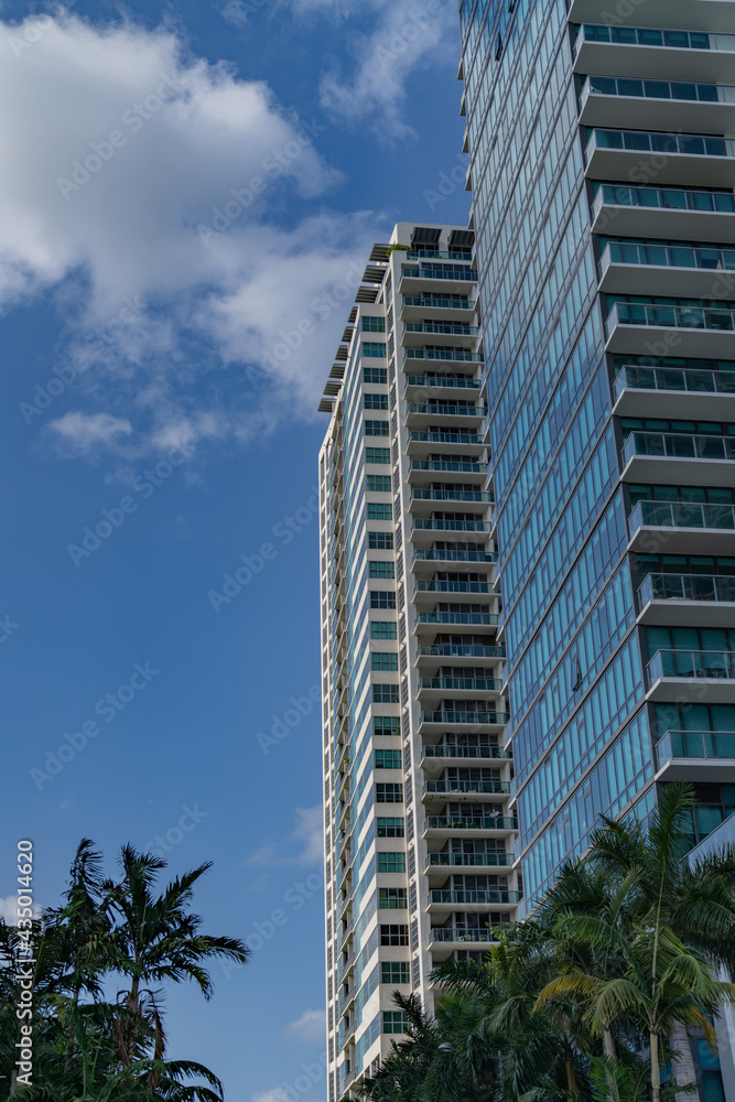 office building sky blue clouds miami city florida usa real state 