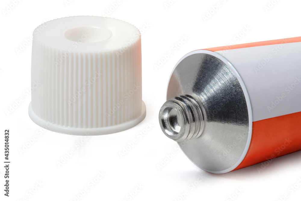 Sealed white with red tube of ointment and cap on a white background. Full depth of field. With clipping path Sealed white with red tube of ointment and cap on a white background. Full depth of field. With clipping path