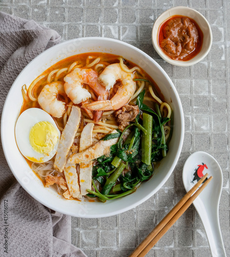 Photography Homemade soup noodle meal / Spicy Prawn Noodle / A popular street food made famo