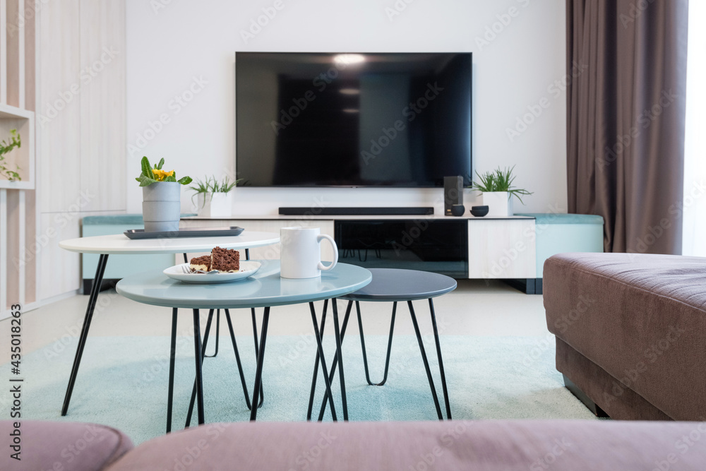 Fototapeta premium Contemporary living room - wall with TV and table