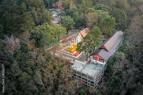 Wat Phra That Doi Tung from above birdeyes view, a famous Temple and Buddhism place. It's settled on the mountain in Chiang Rai province, north of Thailand. photo