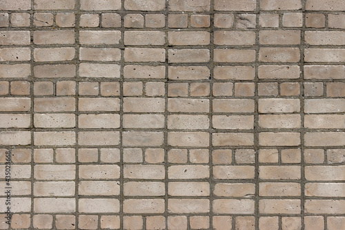 Texture of a lined brick wall.