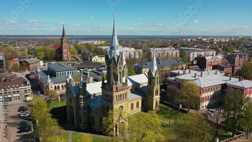 Liepaja, Latvia,Baltics. Beautiful 4K panoramic aerial video from flying drone to Liepaja city St. Joseph's Cathedral  which is located by the Baltic Sea. (Series)  photo