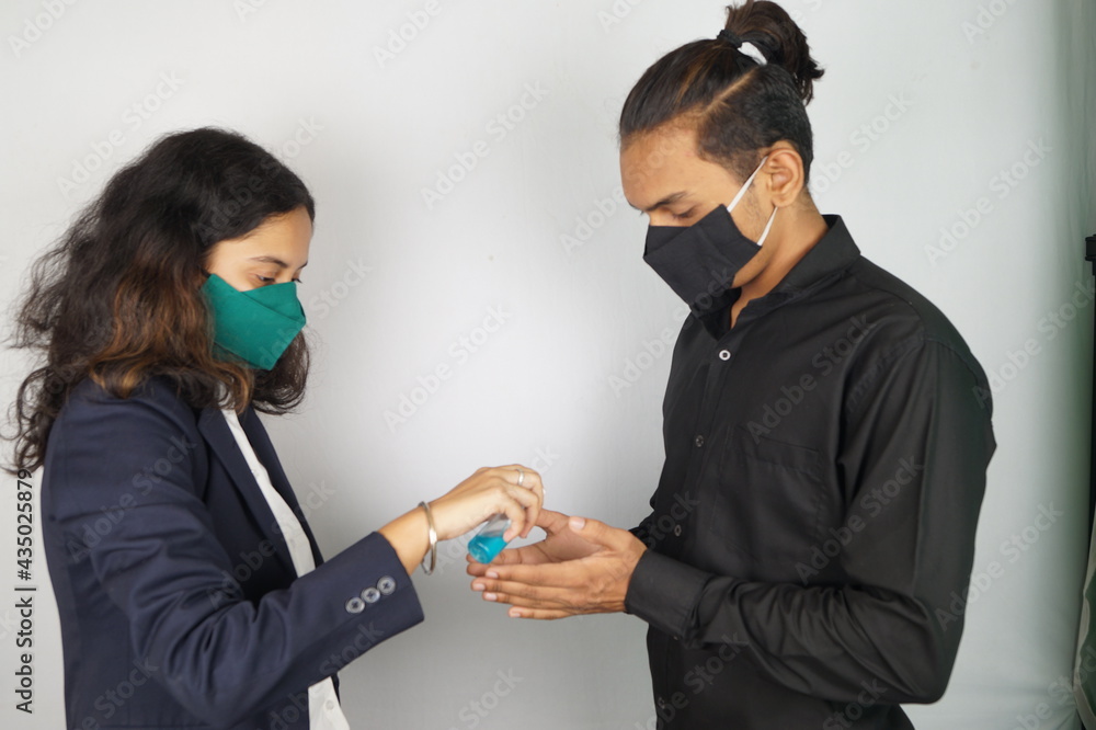 Girl Wearing Mask In Office , corona warriors , young man wearing mask , corona warriors , using sanitizer image . Vastav Kharat . Girl Wearing Mask In Office , corona warriors , young man wearing mask , corona warriors , using sanitizer image . Vastav Kharat .