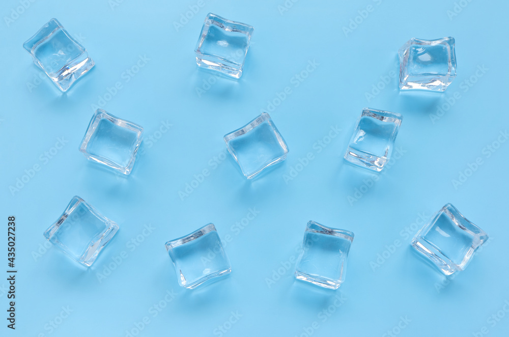 Acrylic ice cubes, Plastic ice cubes on light blue background. Acrylic ice cubes, Plastic ice cubes on light blue background.