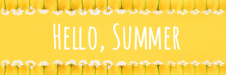 Hello Summer text and border from chamomile flowers on yellow background. Concept Welcome summer time. Banner