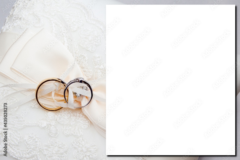Wedding invitation card template of Top view blank empty paper card with  marriage golden rings on on white bride dress background Stock Photo |  Adobe Stock
