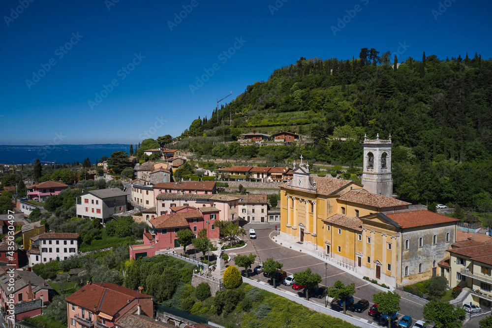 Italian classic town on the hill. Cavaion Veronese Aerial View, Lake Garda, Italy. church of saint john baptist on the hill aerial view.