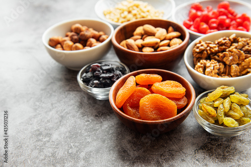 Bowls with various dried fruits and nuts