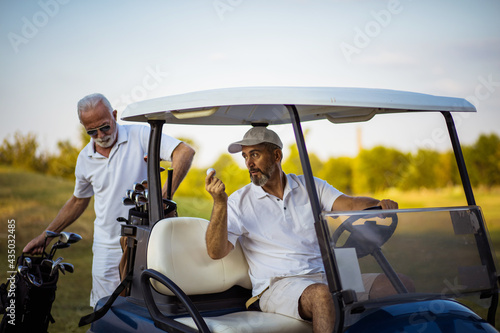 Professional golfers having chat.