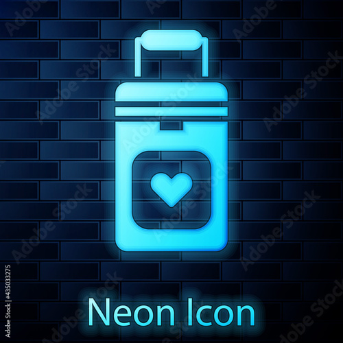 Glowing neon Cooler box for human organs transportation icon isolated on brick wall background. Organ transplantation concept. Organ container. Vector Illustration