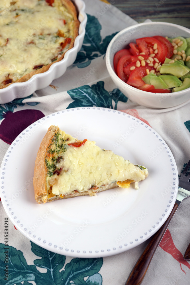 Kish. Homemade pie with scrambled eggs, vegetables and cheese. Kish. Homemade pie with scrambled eggs, vegetables and cheese.