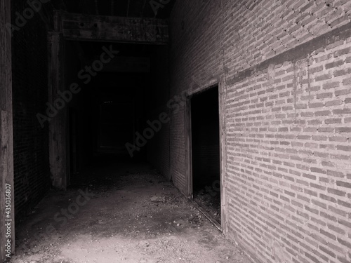 The brick walls of the old abandoned buildings are scary.