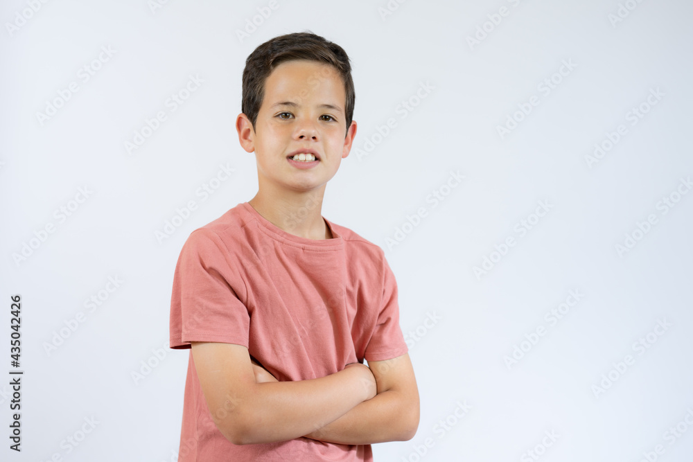 Young handsome boy standing on white studio background. Young handsome boy standing on white studio background.