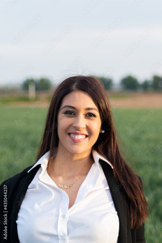 portrait of brunette girl black eyes at sunset in the field portrait of brunette girl black eyes at sunset in the field