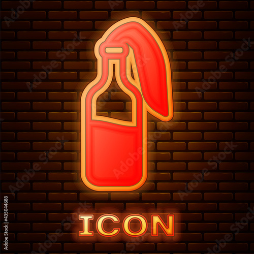 Glowing neon Cocktail molotov icon isolated on brick wall background. Vector