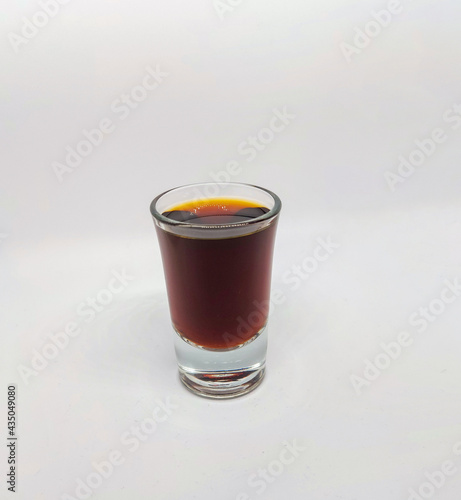 Close up of a jager shot glass on white background photo