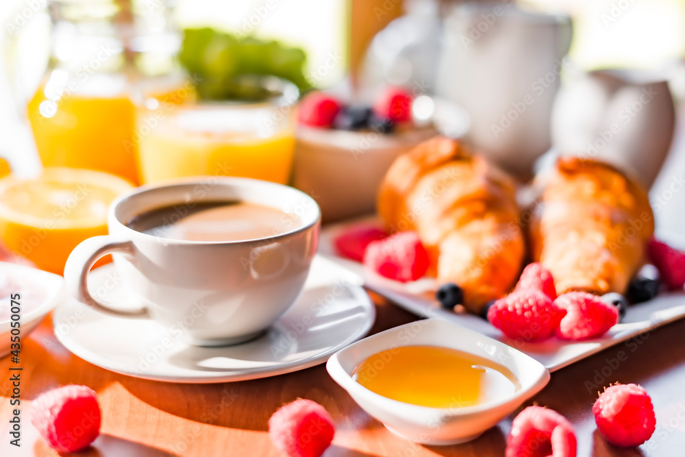 Breakfast served with coffee, orange juice, croissants, cereals