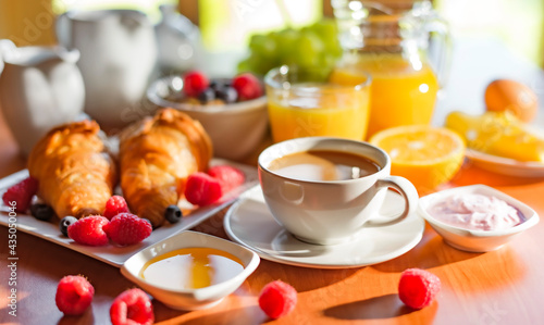 Breakfast served with coffee, orange juice, croissants, cereals © monticellllo
