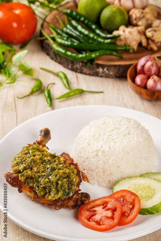 Fried Chicken with Sambal Lado Mudo or sambal Cabe Ijo and rice. This is traditional cuisine from Padang, West Sumatra Fried Chicken with Sambal Lado Mudo or sambal Cabe Ijo and rice. This is traditional cuisine from Padang, West Sumatra