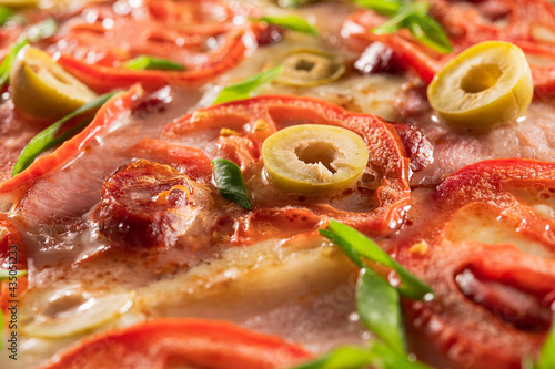Macro pizza with tomato, bacon and green olives