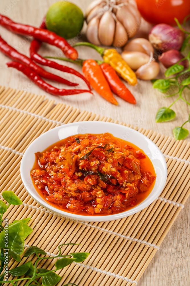 Sambal Balado with chili ingredient. Sambal Balado is Traditional red chili paste from Padang, West Sumatra Sambal Balado with chili ingredient. Sambal Balado is Traditional red chili paste from Padang, West Sumatra