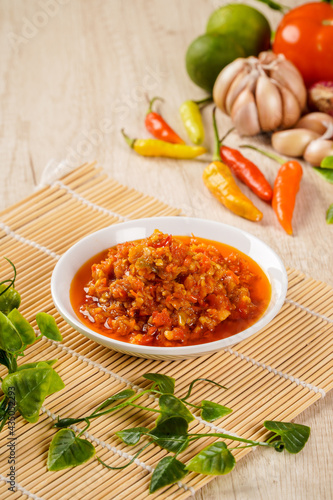 Sambal Bawang Or Spicy Onion Sauce with ingredients, Onion, Red Chilies, garlic, and salt. Sambal Bawang is favorite chili sauce in Indonesia