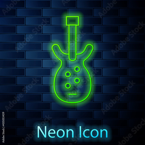 Glowing neon line Electric bass guitar icon isolated on brick wall background. Vector