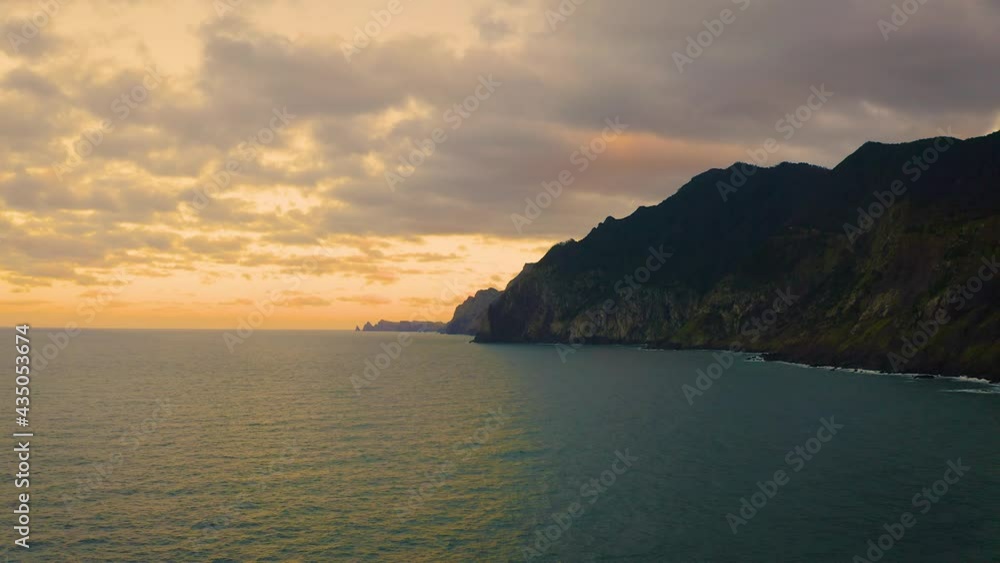 Flying alont the coast of Madeira Island at sunset Flying alont the coast of Madeira Island at sunset