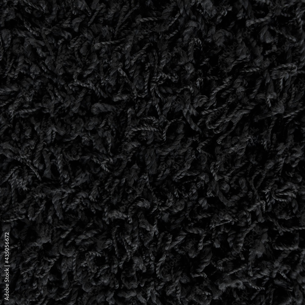 Fototapeta premium Close up of black shaggy rug texture