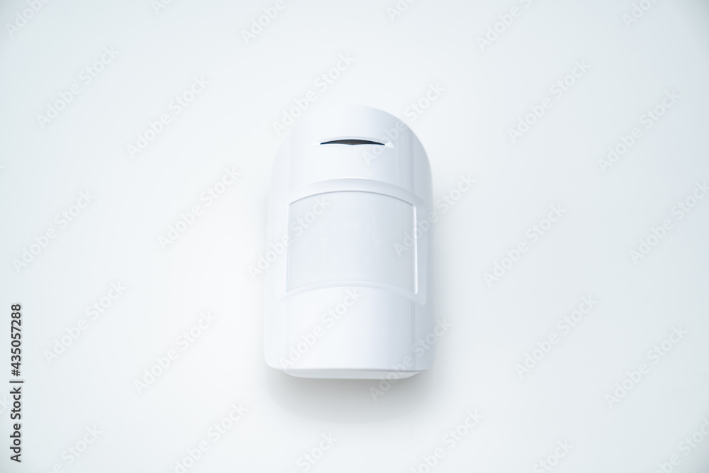 motion sensor on the white background. device that tracks movement of objects. motion sensor on the white background. device that tracks movement of objects.