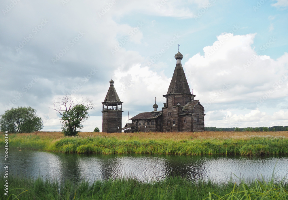 The ancient wooden Church of St. John Chrysostom built in 1665 on the banks of the river in the village of Saunino, Arkhangelsk region