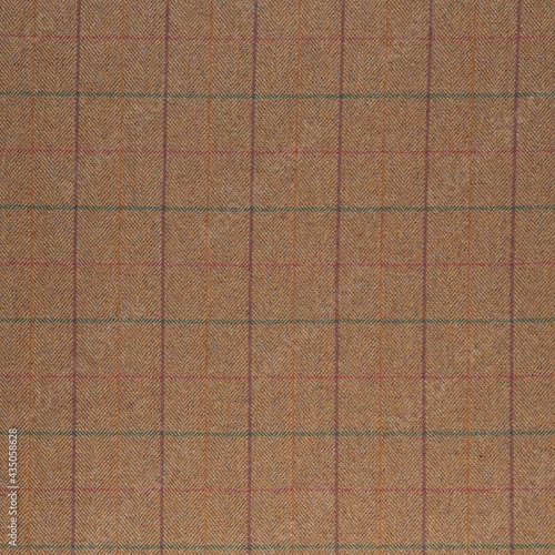 Plaid tweed fabric texture in brown