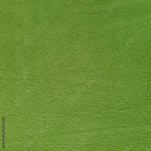 Plain polyester fleece fabric texture in green