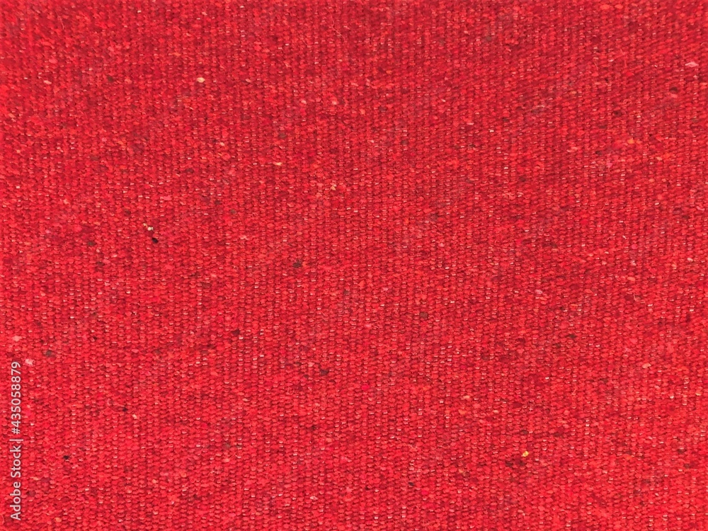 Fototapeta premium Red woven wool blend speckled tweed upholstery fabric texture