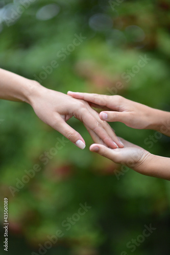 granddaughter and grandmother holding hands