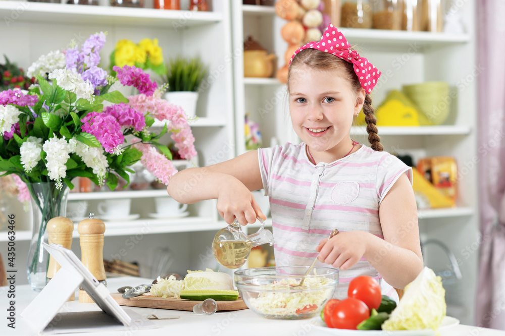 Cute girl preparing delicious fresh salad in kitchen Cute girl preparing delicious fresh salad in kitchen