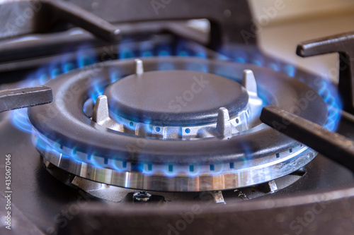 A burning gas burner in the kitchen. The use of natural gas in the household.