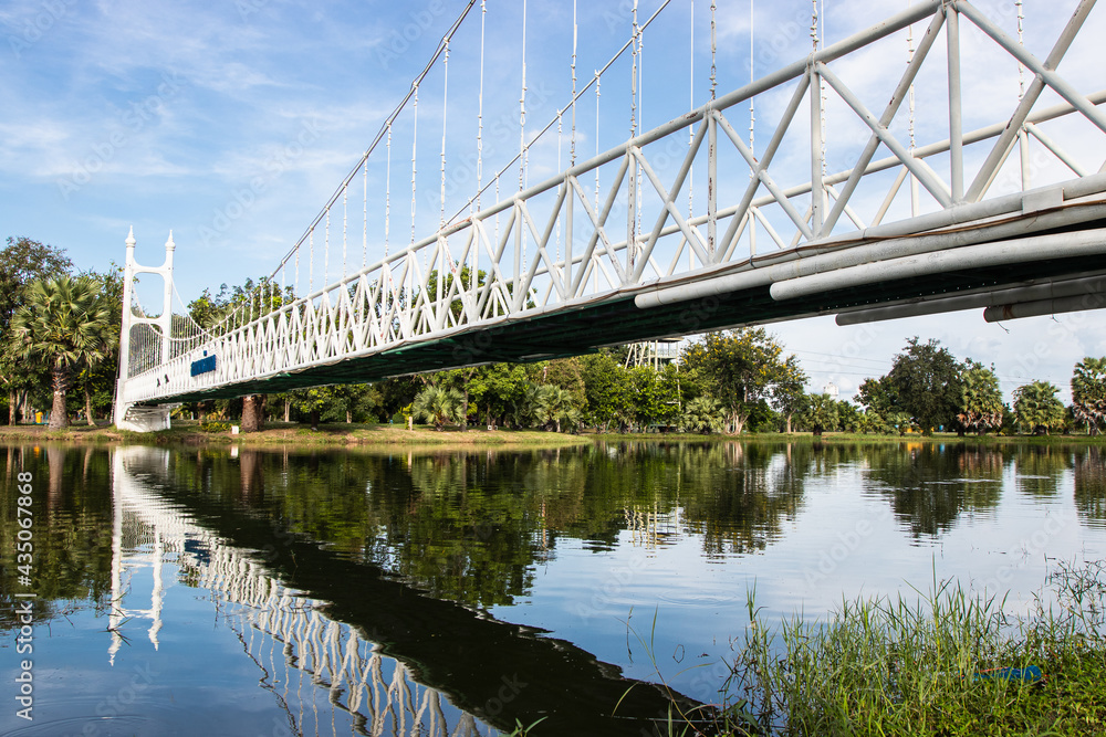 NAKHON RATCHASIMA, THAILAND - MARCH 17, 2020: The white bridge at Bung Ta Lua Water Park in Nakhon Ratchasima, Thailand NAKHON RATCHASIMA, THAILAND - MARCH 17, 2020: The white bridge at Bung Ta Lua Water Park in Nakhon Ratchasima, Thailand