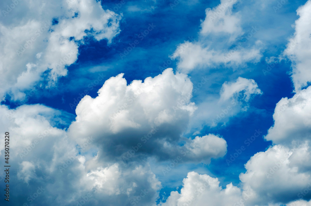 Fototapeta premium blue sky with dark blue, gray and white clouds with background texture