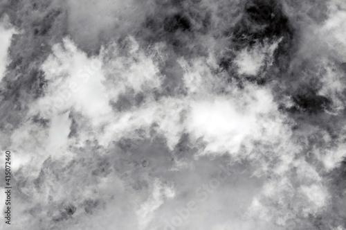 sky with dark black, gray and white clouds with background texture