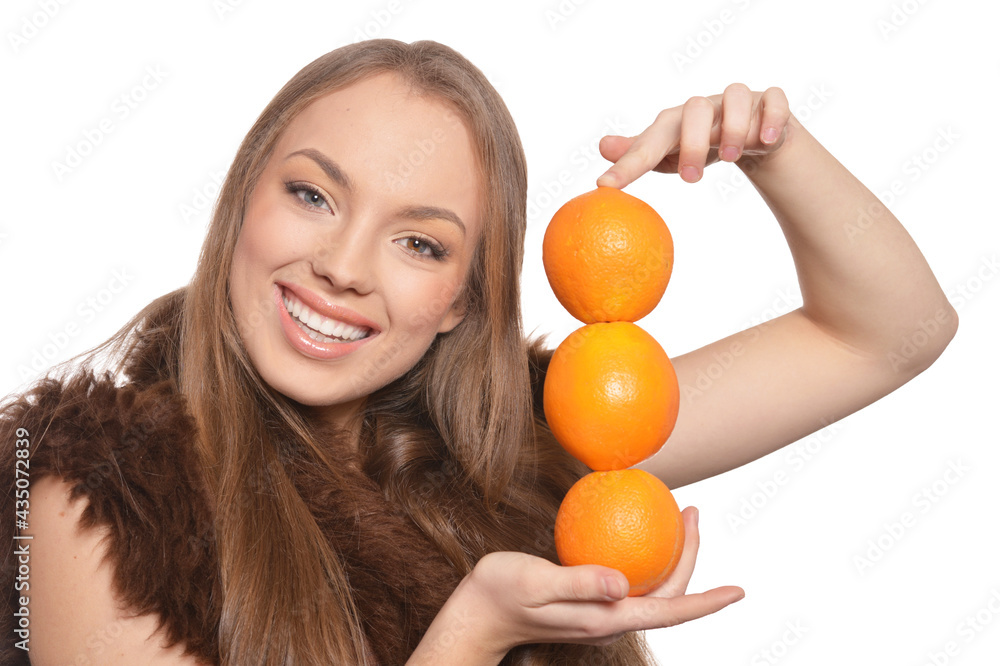 Portrait of young woman posing with orange Portrait of young woman posing with orange