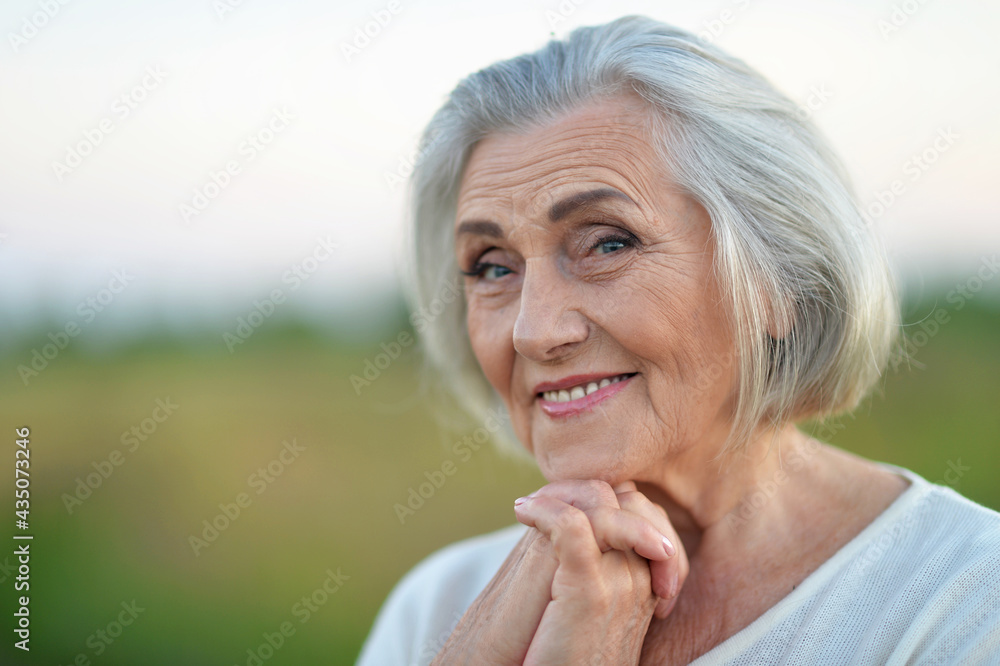 Happy senior woman in park Happy senior woman in park