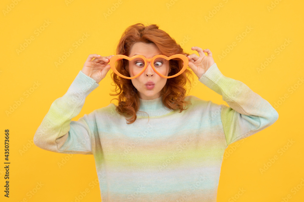 happy redhead woman wear funny party glasses on yellow background, party time happy redhead woman wear funny party glasses on yellow background, party time
